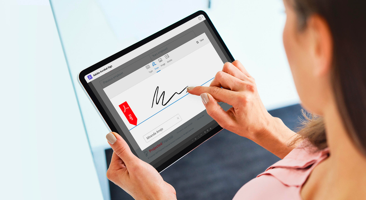 Woman holding an ipad using Adobe Acrobat Sign using the signing feature.